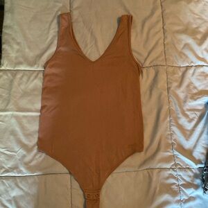 Medium dusty rose body suit.